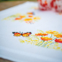 Kit Nappe imprimée Point de Croix - Fleurs orange et papillons - Vervaco